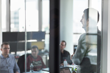 Image showing Business team leader delivering presentation in office.