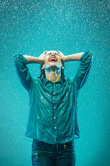 Image showing The portrait of young beautiful woman in the rain