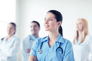 Image showing female doctor in front of medical group