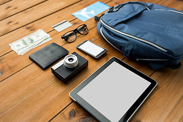 Image showing close up of smartphone and travel stuff