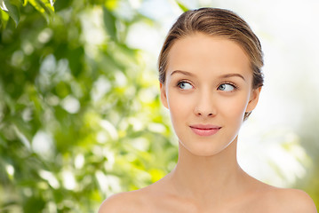 Image showing smiling young woman face and shoulders