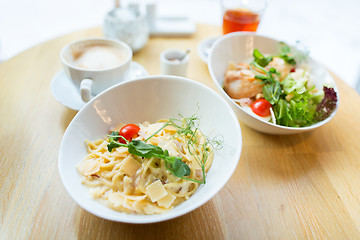 Image showing close up of pasta in bowl on table at restaurant