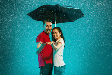 Image showing The loving couple in the rain