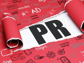 Image showing Marketing concept: black text PR under the piece of  torn paper