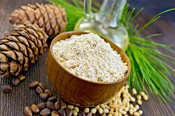 Image showing Flour cedar in wooden bowl with oil on board