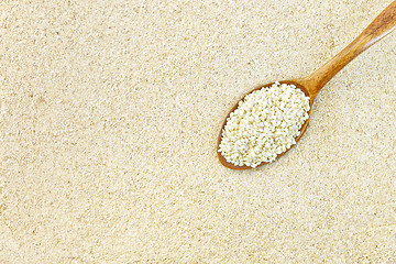 Image showing Flour sesame with seeds in spoon