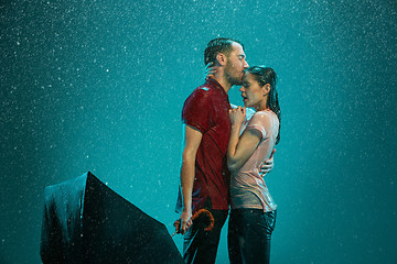 Image showing The loving couple in the rain