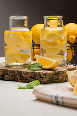 Image showing Lemon and lime slices in jars