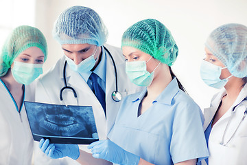 Image showing young group of doctors looking at x-ray