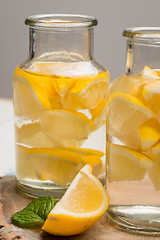 Image showing Lemon and lime slices in jars