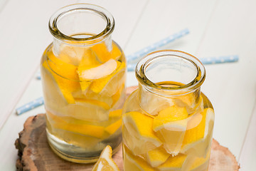 Image showing Lemon and lime slices in jars