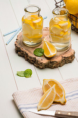 Image showing Lemon and lime slices in jars