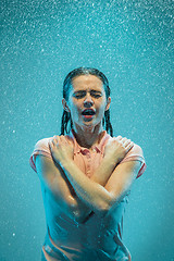 Image showing The portrait of young beautiful woman in the rain