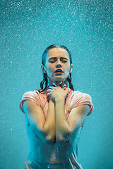 Image showing The portrait of young beautiful woman in the rain