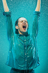 Image showing The portrait of young beautiful woman in the rain