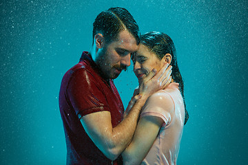 Image showing The loving couple in the rain