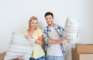 Image showing happy couple with stuff moving to new home