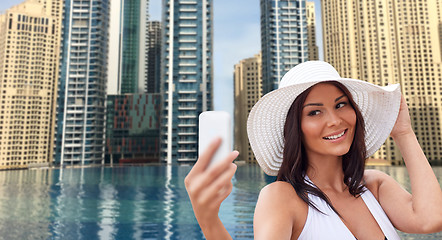 Image showing young woman taking selfie with smartphone