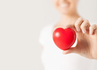 Image showing happy woman with small red heart