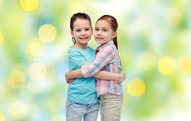 Image showing happy smiling little girls hugging