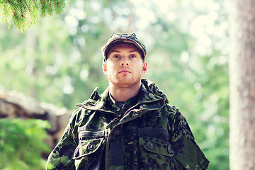 Image showing young soldier or ranger in forest