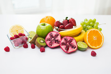 Image showing close up of fresh fruits and berries on table