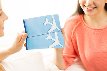 Image showing close up of women with tickets and travel bag