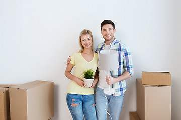 Image showing happy couple with stuff moving to new home