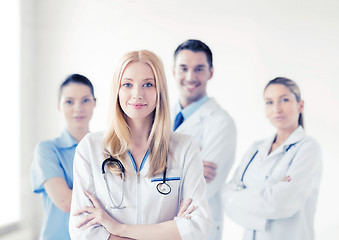 Image showing female doctor in front of medical group