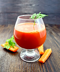 Image showing Juice carrot with parsley in wineglass on board