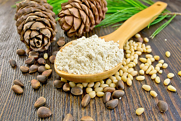 Image showing Flour cedar in wooden spoon on board