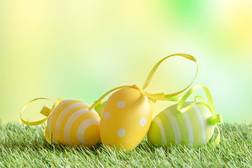 Image showing Easter eggs with patterns on green turf