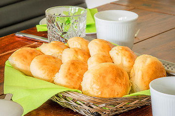 Image showing Breakfast on a table with buns