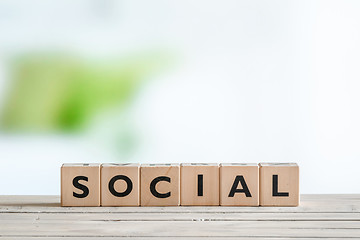 Image showing Social sign on a wooden table