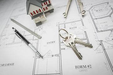 Image showing Home, Pencil, Compass, Ruler and Keys Resting On House Plans