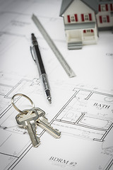Image showing Home, Pencil, Ruler and Keys Resting On House Plans