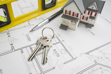 Image showing Home, Construction Level, Pencil and Keys Resting on House Plans