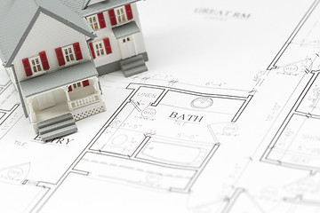 Image showing Model House Resting on House Plans