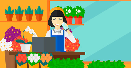 Image showing Florist taking order.