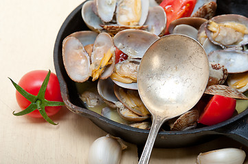 Image showing fresh clams on an iron skillet