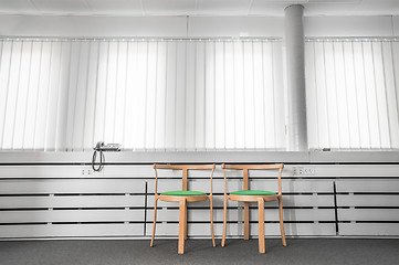 Image showing Green chairs in a bright office