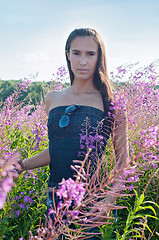 Image showing Beautiful brunette woman in field