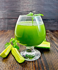 Image showing Juice cucumber in wineglass on dark board