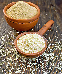 Image showing Sesame seeds in ladle on board