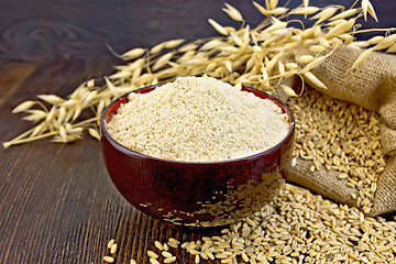 Image showing Flour oat in bowl on board