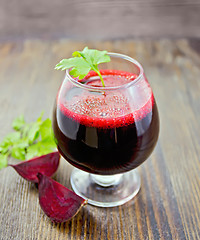 Image showing Juice beet in wineglass on board