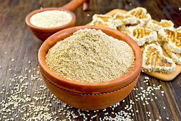 Image showing Flour sesame in bowl with cookies on board