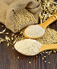 Image showing Flour and bran flakes oat in a spoon on the board