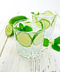 Image showing Lemonade with cucumber and mint on light board