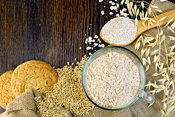 Image showing Flour and bran oat with cookies on board